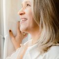 Headshot of a smiling woman in her late 40s with a natural, friendly look.